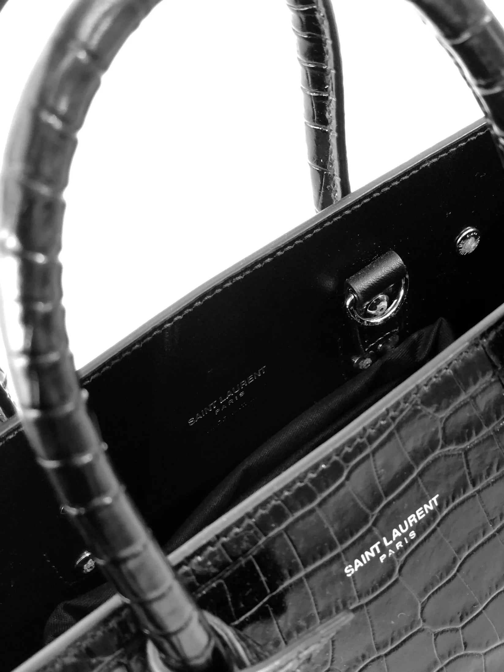 Saint Laurent Sac de Jour bag in crocodile-embossed leather.