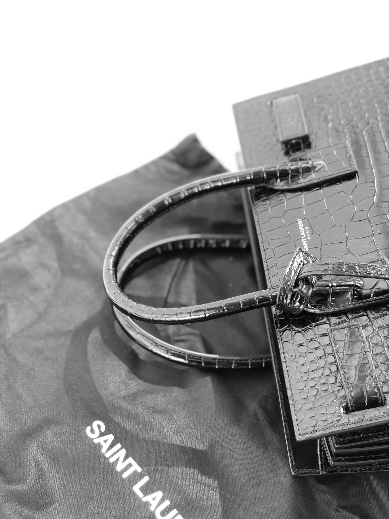 Saint Laurent Sac de Jour bag in crocodile-embossed leather.